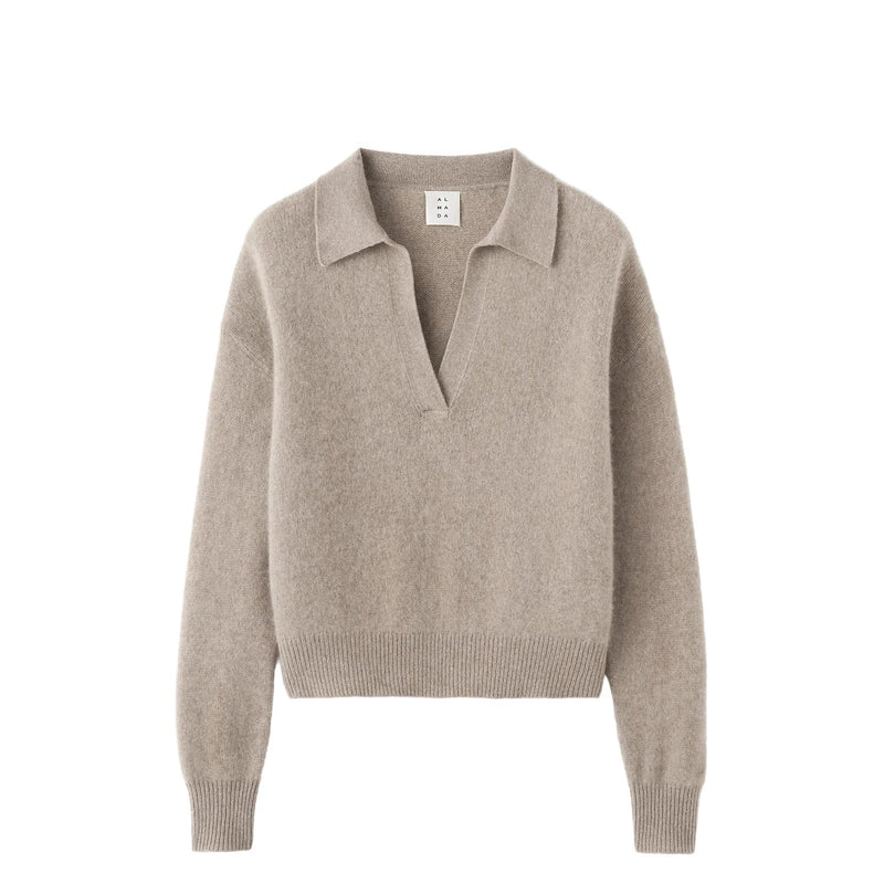 Beige sweater with a collar on a white background