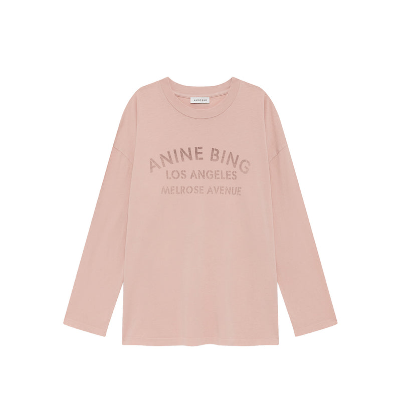Pink long-sleeve shirt with 'Anine Bing Los Angeles' text on a white background
