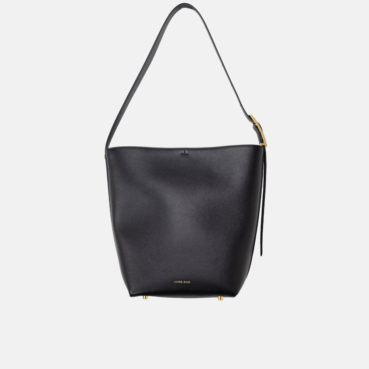 Black handbag with a gold zipper on a light gray background