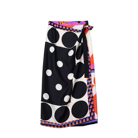 Colorful skirt with black polka dots on a white background