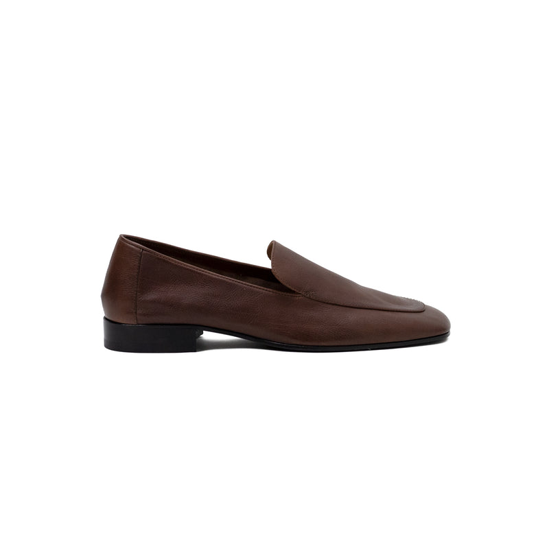 Brown loafer shoe on a white background