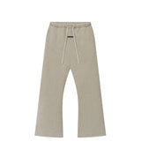 A pair of light beige heathered sweatpants with an elastic waistband and white drawstrings, shown flat against a solid white background.