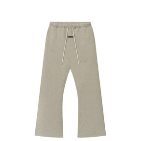A pair of light beige heathered sweatpants with an elastic waistband and white drawstrings, shown flat against a solid white background.