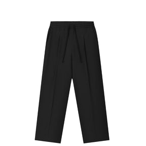 Black wide-leg trousers with a drawstring waistband, shown flat against a solid white background.