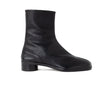 A single black leather ankle boot with a low block heel, shown in a side profile view against a plain white background.