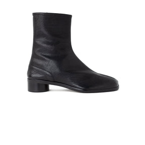A single black leather ankle boot with a low block heel, shown in a side profile view against a plain white background.