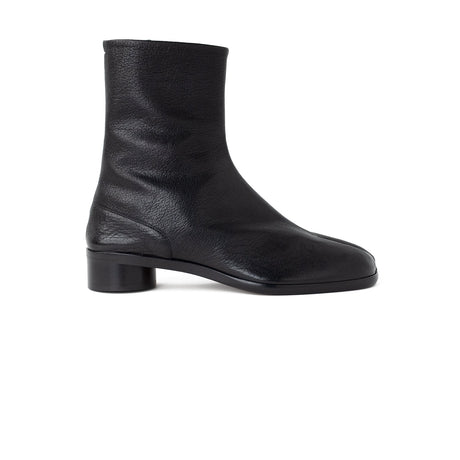 A single black leather ankle boot with a low block heel, shown in a side profile view against a plain white background.