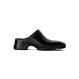Black clog shoe on a white background