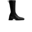 Black knee-high boot on a white background