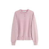 Pink sweatshirt on a white background with 'Our Legacy' branding.