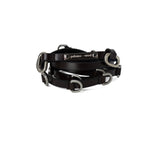 Black leather bridle with silver hardware on a white background