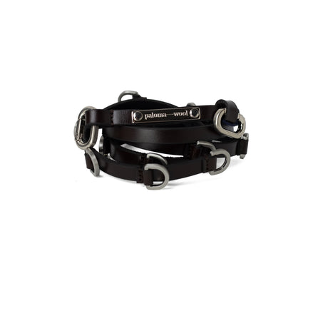 Black leather bridle with silver hardware on a white background