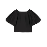 Black off-shoulder top on a white background