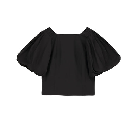 Black off-shoulder top on a white background