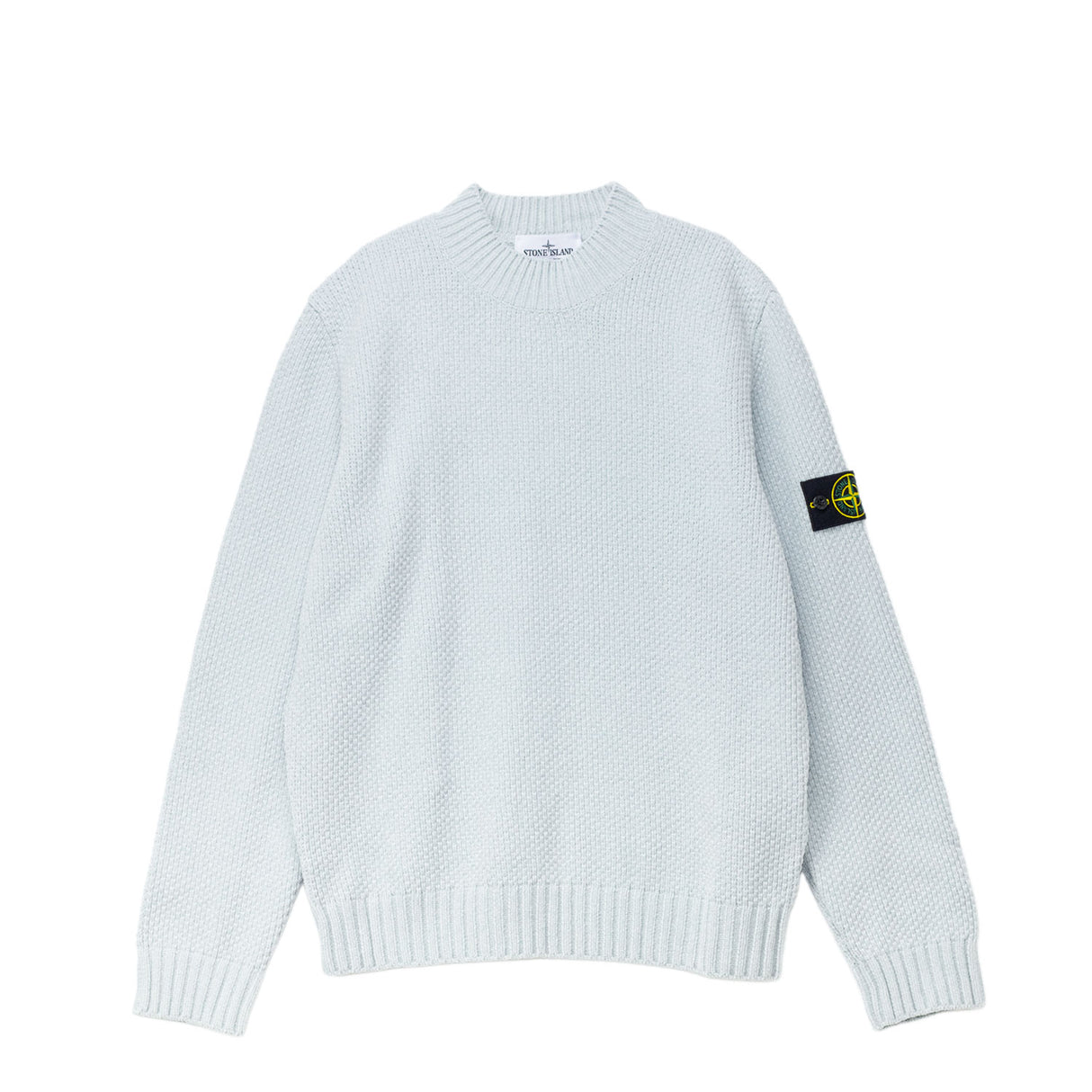 Light blue sweater with branded patch on the left sleeves.