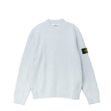 Light blue sweater with branded patch on the left sleeves.