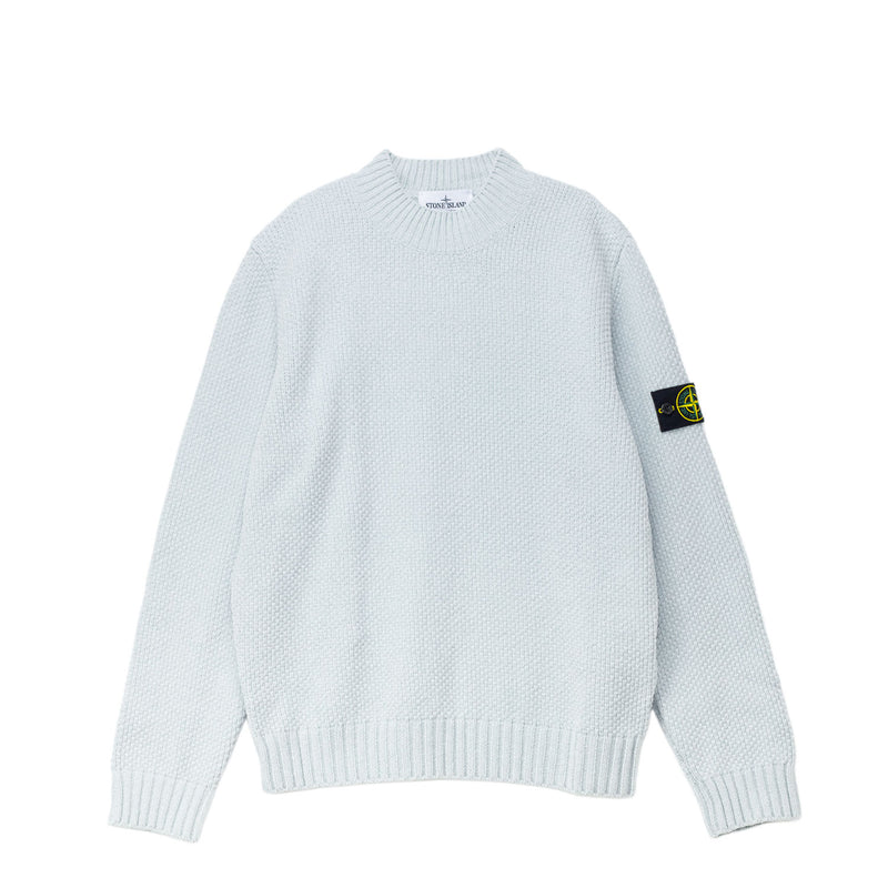 Light blue sweater with branded patch on the left sleeves.