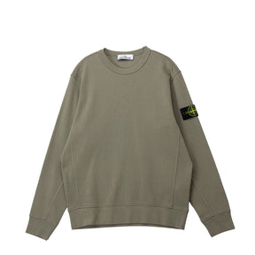 Green sweatshirt on a white background