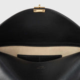 TOTEME T-LOCK LEATHER CLUTCH, Black
