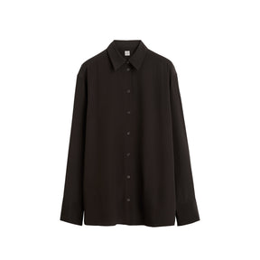 A black long-sleeve button-up shirt with a pointed collar, displayed flat against a solid white background.