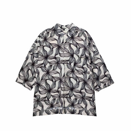 Black floral patterned shirt on a white background
